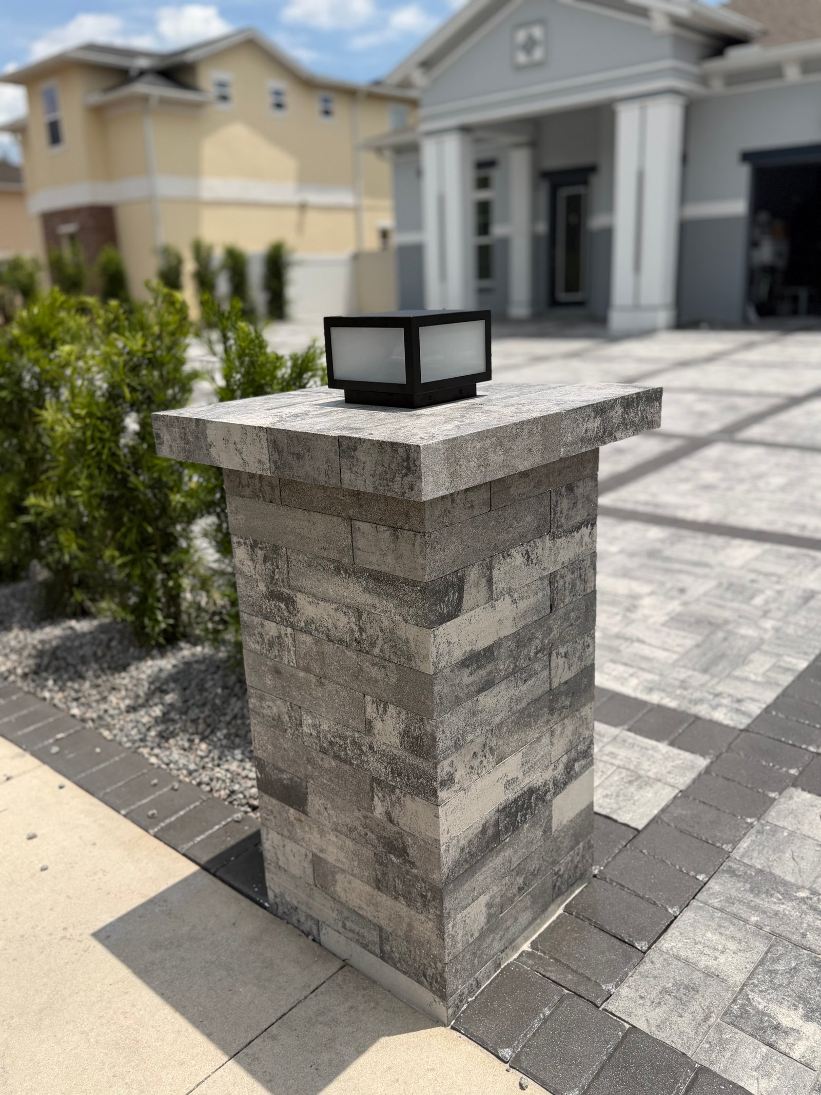 Close-up of stacked stone pillar with lantern